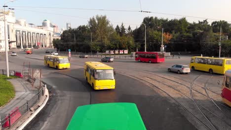 city intersection with buses and trams