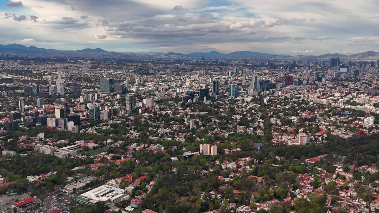Clear day aerial view of Mexico City’s urban sprawl and skyscraper