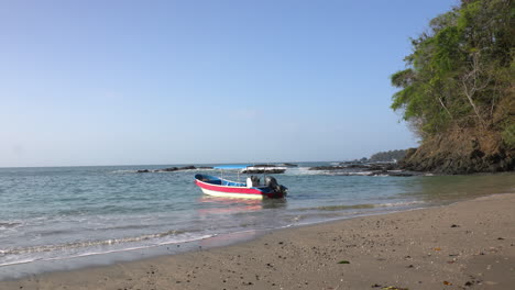 static shot of a boat floating in the current at cebaco island veraguas