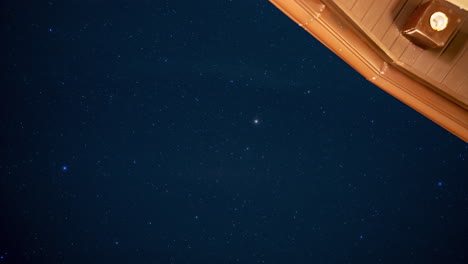 time-lapse of the starry night sky from a vacation house