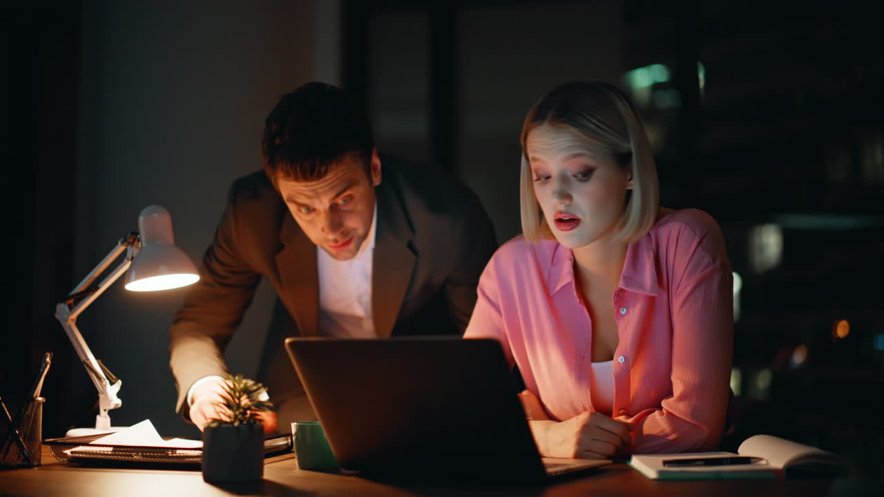 Teamwork in the Office at Night