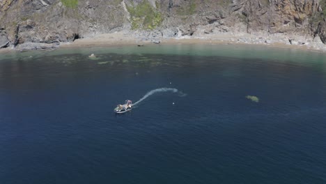 crab boat heads into deeper water after picking up traps near shore