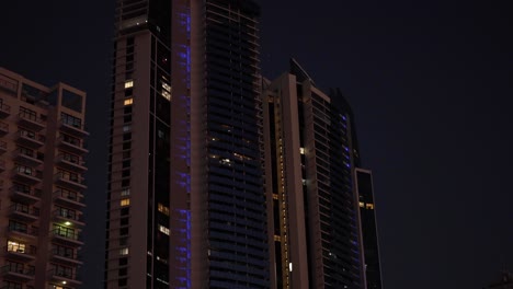 skyscrapers and waterfront at night with lights