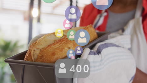 holding freshly baked bread, person surrounded by animated social media followers