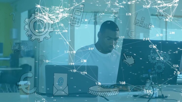 Animation of network of connections and media icons over businessman at desk using computer