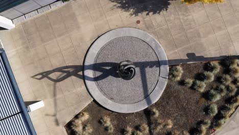 top view of an artistic swirl sculpture in an outdoor garden