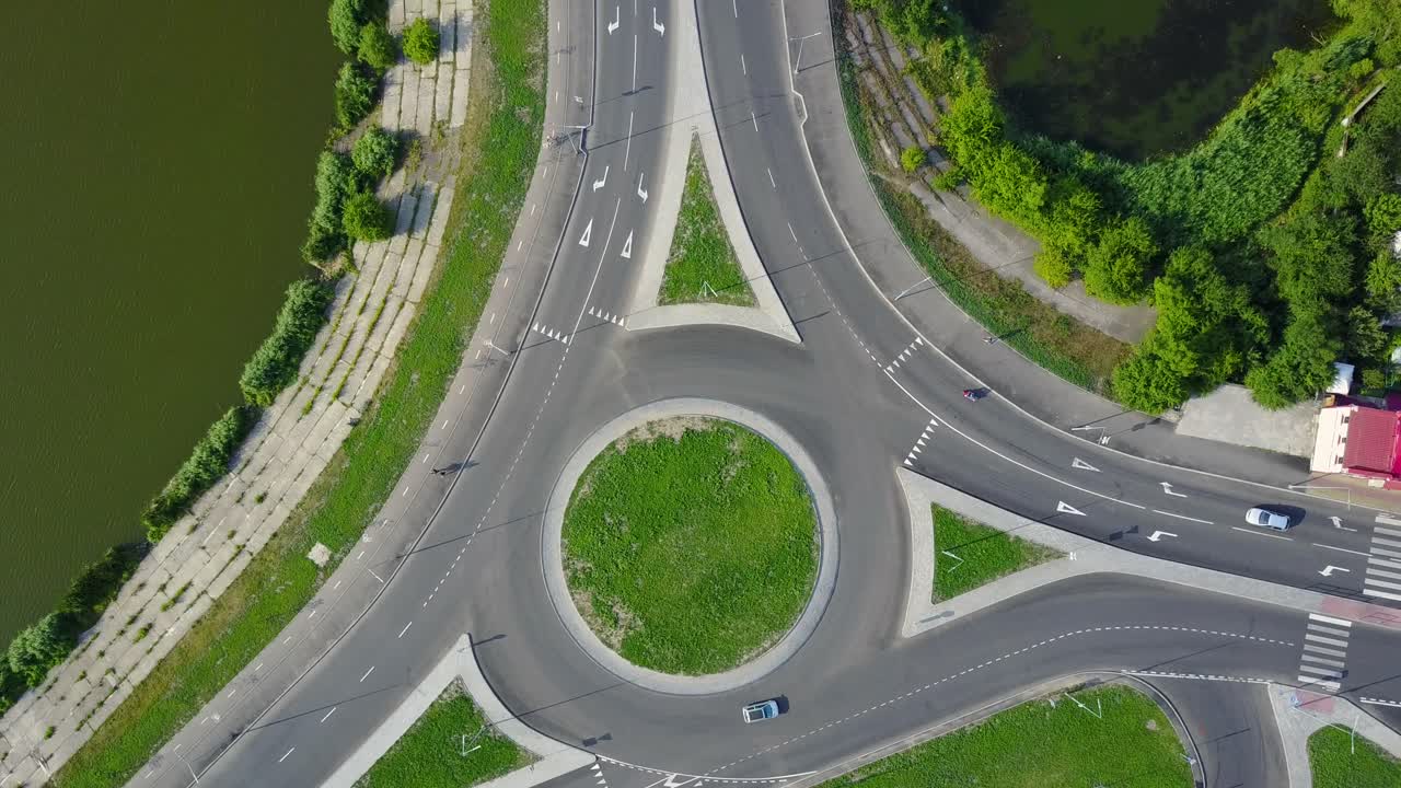 Circular Movement At The Traffic Intersection. Aerial view of roundabout in the city in the summer in Ukraine