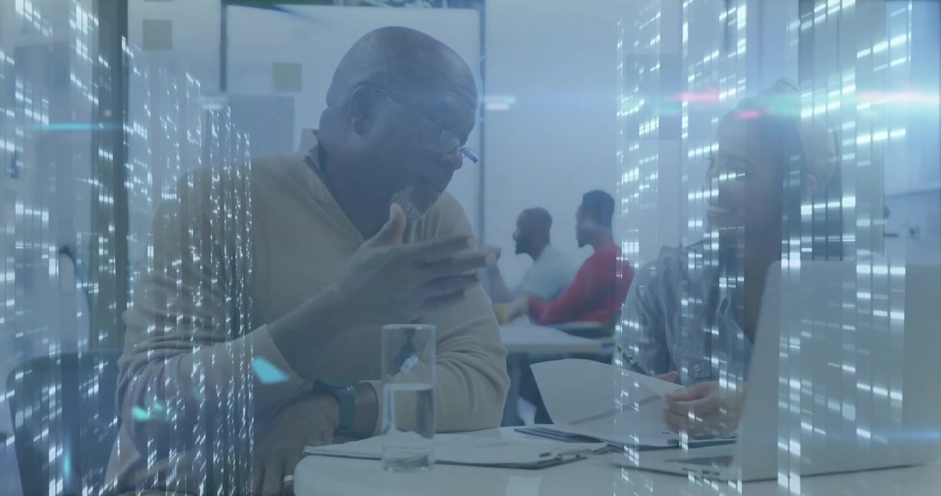 Senior man pointing document and guiding woman on laptop using data streams for business analysis