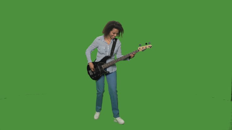 Woman Playing Bass Guitar on Green Screen