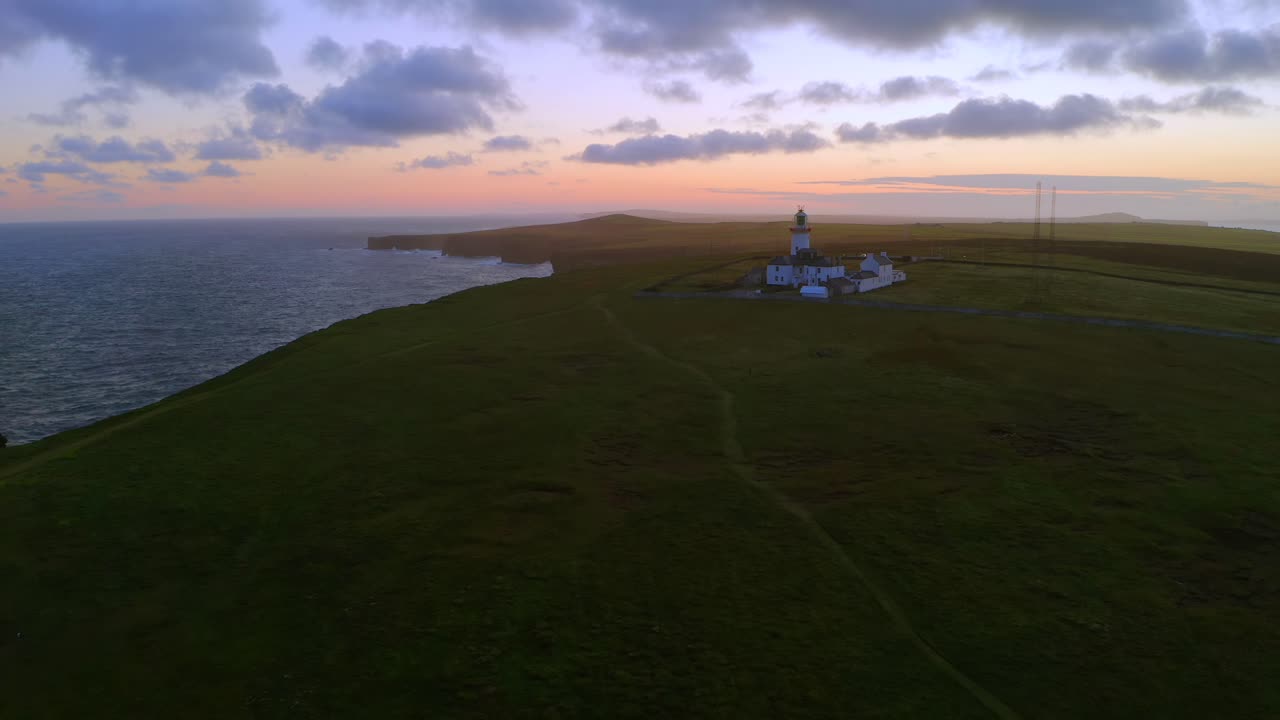 Aerial dolly of Loop Head Lighthouse in County Clare during a stunning morning