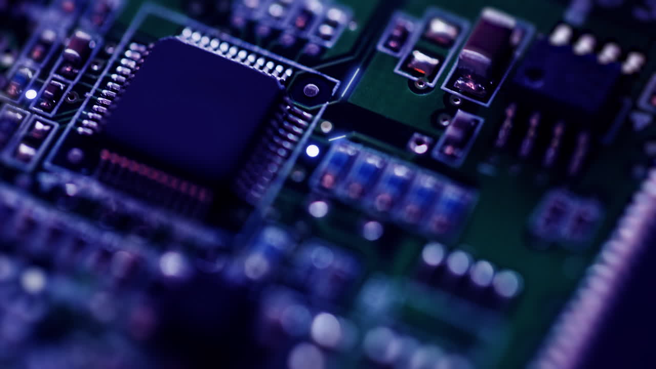 Close-up of electronic circuit board with microchip, technology animation