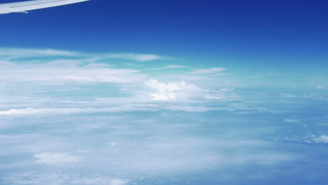 Sky-View-From-The-Airplane-Window---Beautiful-Sky,-Clouds,-Wing-Of-Plane-Flying-From-Australia-to-Singapore---aerial,-POV