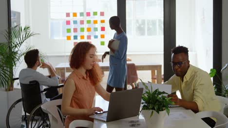 Side-view-of-young-mixed-race-business-team-planning-and-working-in-a-modern-office-4k