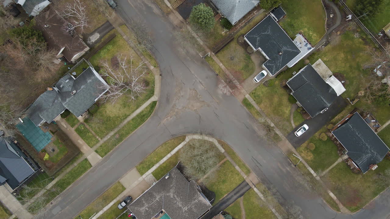 Top View Of Family Houses And Suburban Street In Neighborhood In Welland, Southern Ontario, Canada. aerial rotating shot