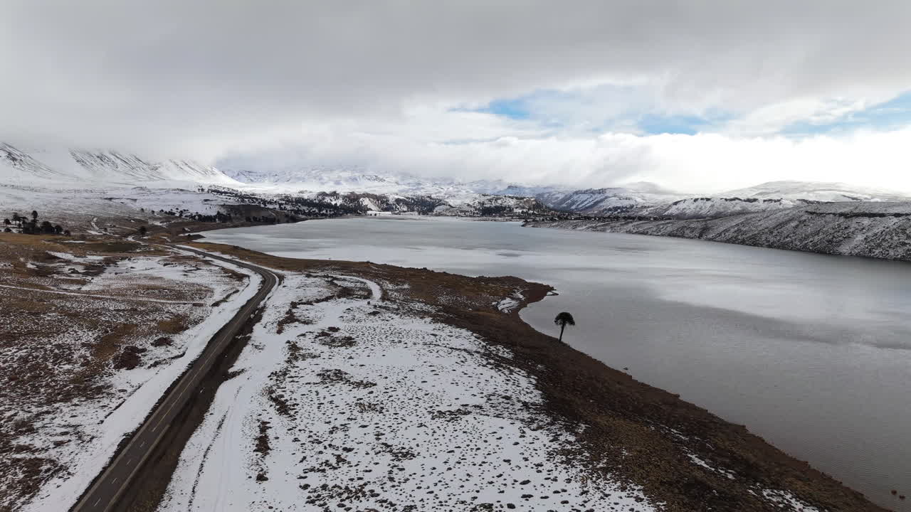 Aerial Drone Over Patagonian Winter Lake and Remote Volcanic Route in Caviahue, Argentina