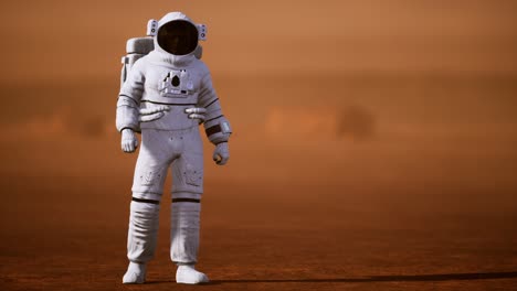 astronauta en la superficie de marte. planeta rojo cubierto de gas y roca