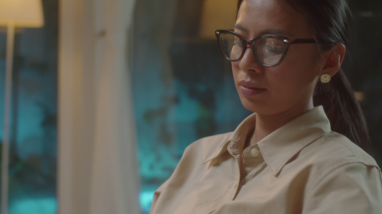 Asian Female Therapist Taking Notes during Consultation