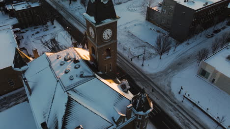 historic washington county courthouse clock tower during winter snow in arkansas, fayetteville