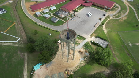 Rotating-drone-shot-of-a-water-tower-under-construction