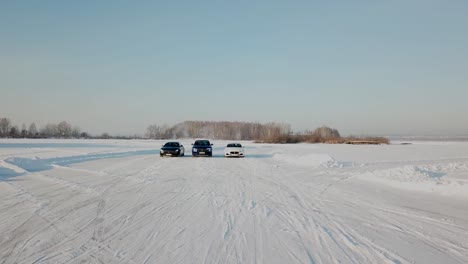 cars driving on frozen lake