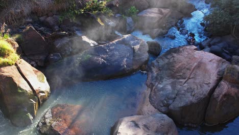 Drone-aerial-shot-approaching-a-tropical-waterfall-In-Brazil-from-above-in-daylight