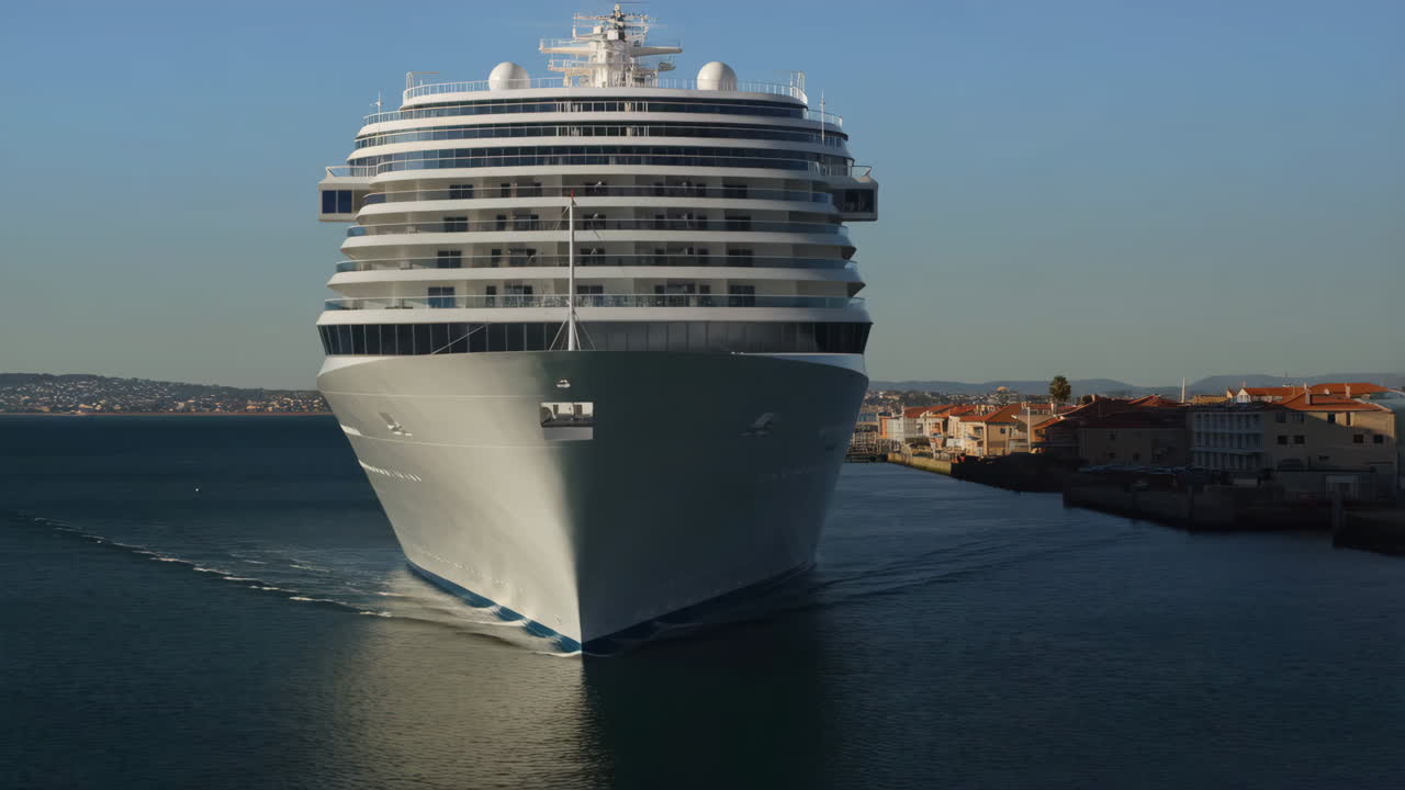 A large cruise ship sailing into or out of a port