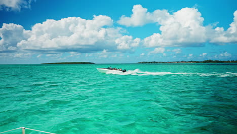 slow motion of boat speeding on tropical ocean heading towards the ile aux fouquets