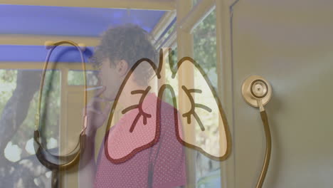 animation of lungs over stethoscope and caucasian boy smoking cigarette in background