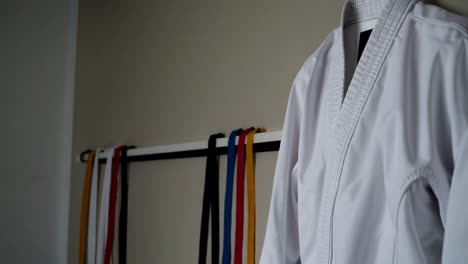 karate gi and belts hanging