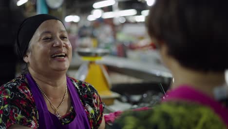 market vendor and customer