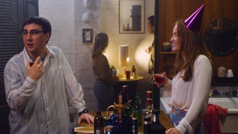 friends celebrating and toasting at a casual house party