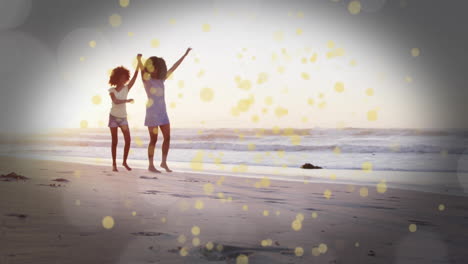 running on beach, two children with golden light particles animation overlay