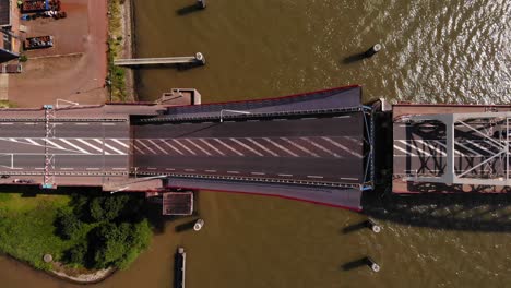 top view of a bascule bridge opening over noord river in alblasserdam, netherlands