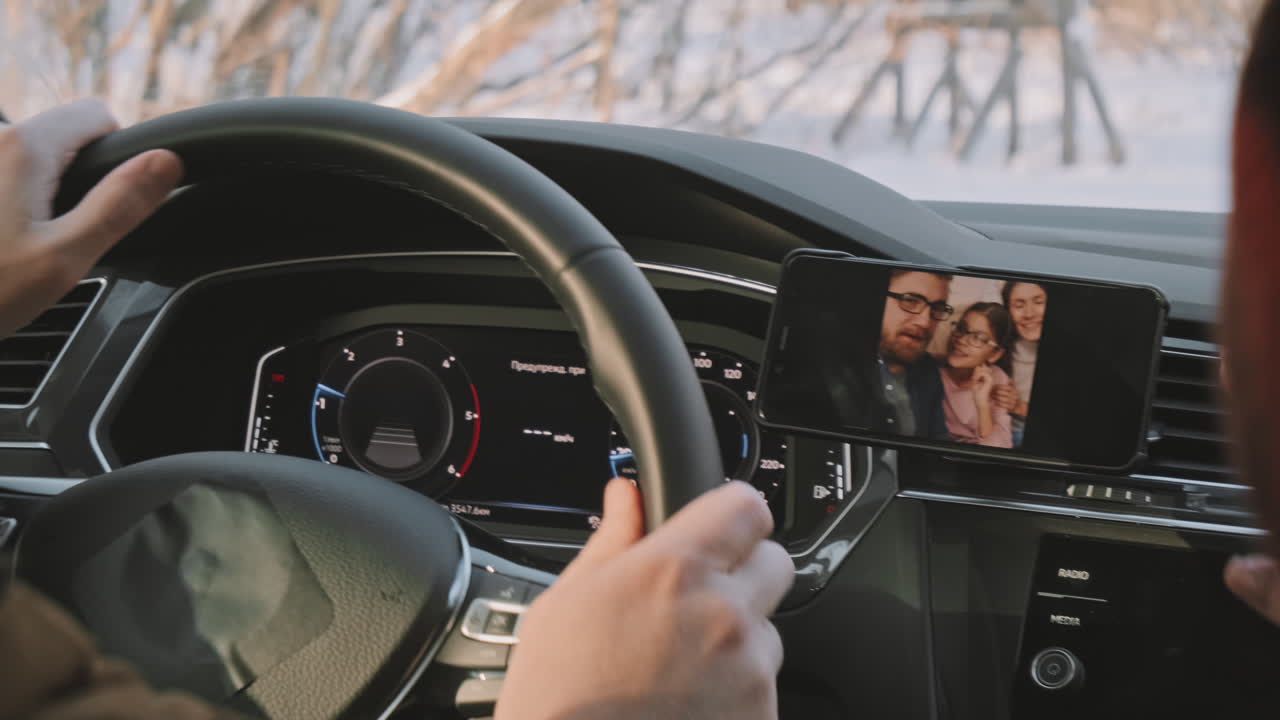 Man Driving in Snow and Chatting on Video Call