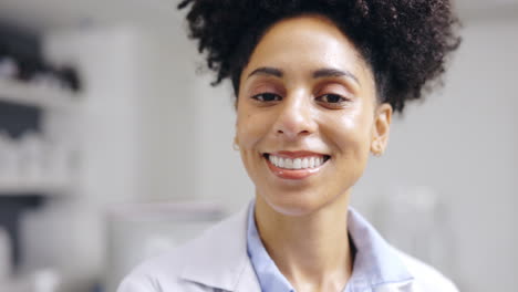 Face-smile,-covid-and-woman-doctor-in-laboratory