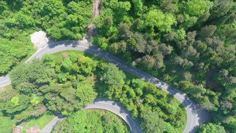 morschach flyover: moving over scenic water valley towards alps mountains, switzerland, europe, drone | top down close up movement over scenic winding hillside roads