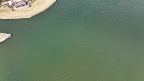 A-top-down-drone-view,-directly-above-the-Great-Bay-in-Bay-Shore,-NY-on-a-sunny-day