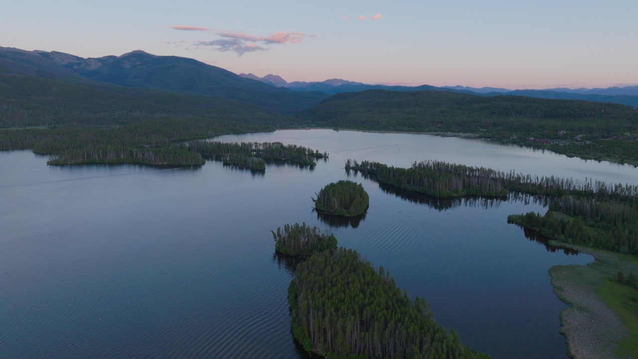 Orbiting Drone shot of Shadow Mountain Lake at sunset in Colorado