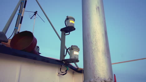 fishing boat deck with navigation lights and antenna