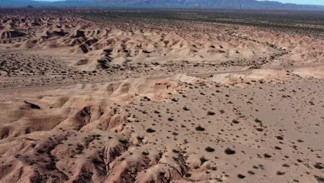 Road-cuts-through-eroded-clay-sand-hills-in-Argentina-mountains