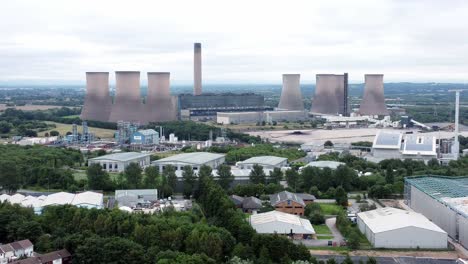 aerial view of a large industrial power plant with cooling towers