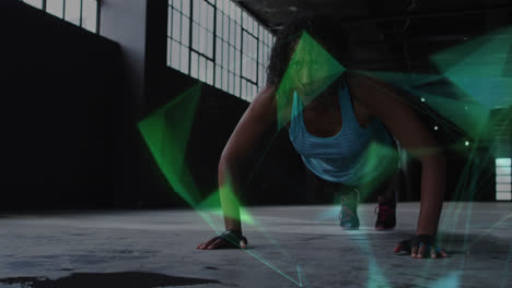 animation of floating colourful shapes over woman doing push ups in an abandoned building