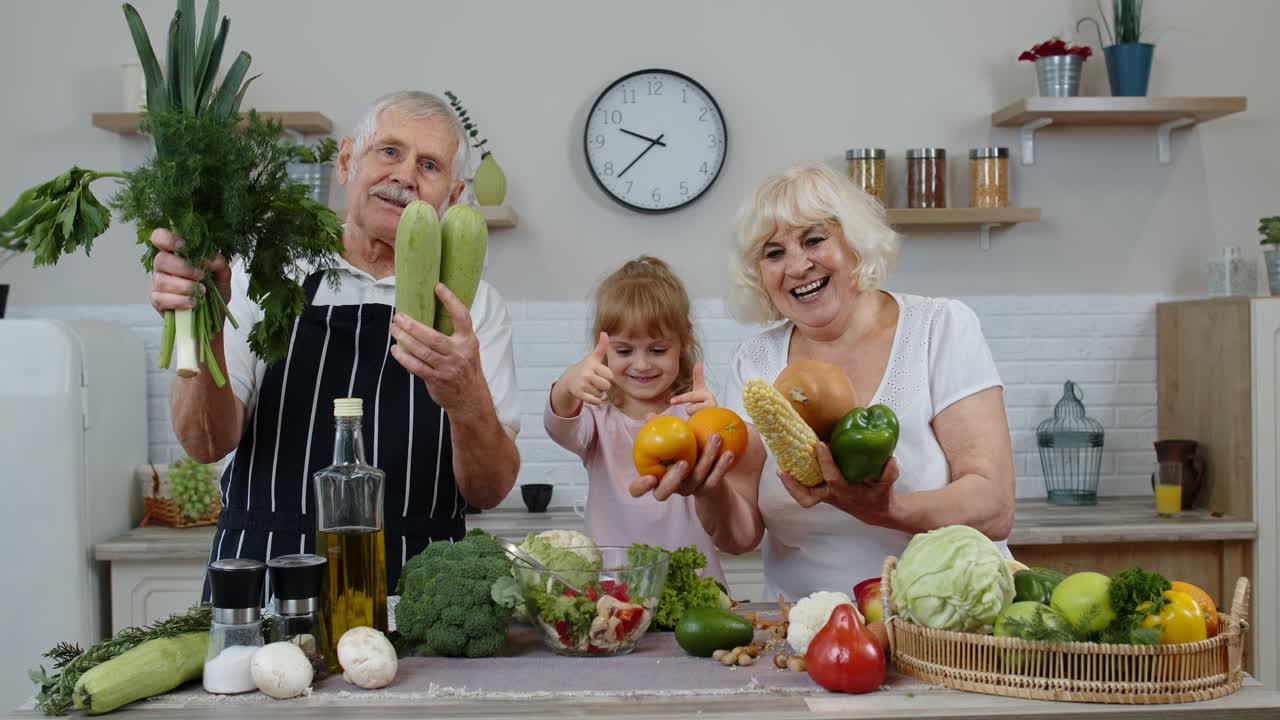 Girl with mature man and woman recommending eating raw vegetable food. Healthy nutrition diet