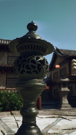 close up of a traditional chinese lantern in a garden setting