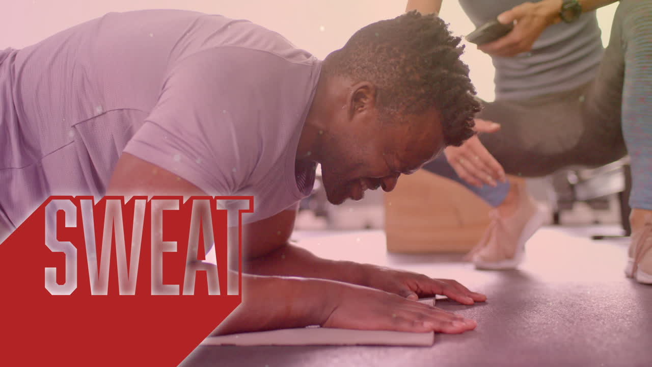 Animation of sweat text over diverse man and woman exercising in gym, man doing plank