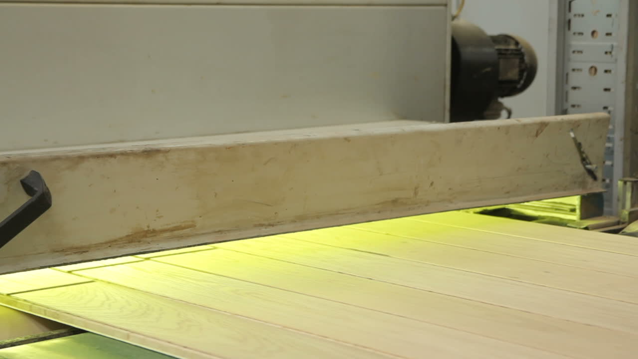 Parquet production. Industrial factory.. Parquet moving in a special device.