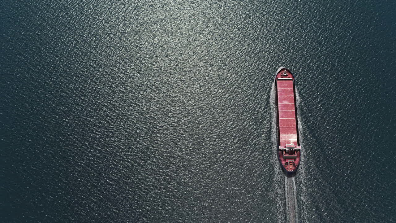 Aerial View of a Cargo Ship on Dark Water