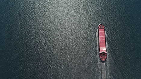 aerial view of a cargo ship on dark water