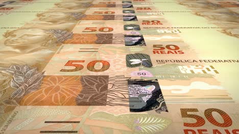 banknotes of fifty brazilian reals rolling on screen, cash money, loop