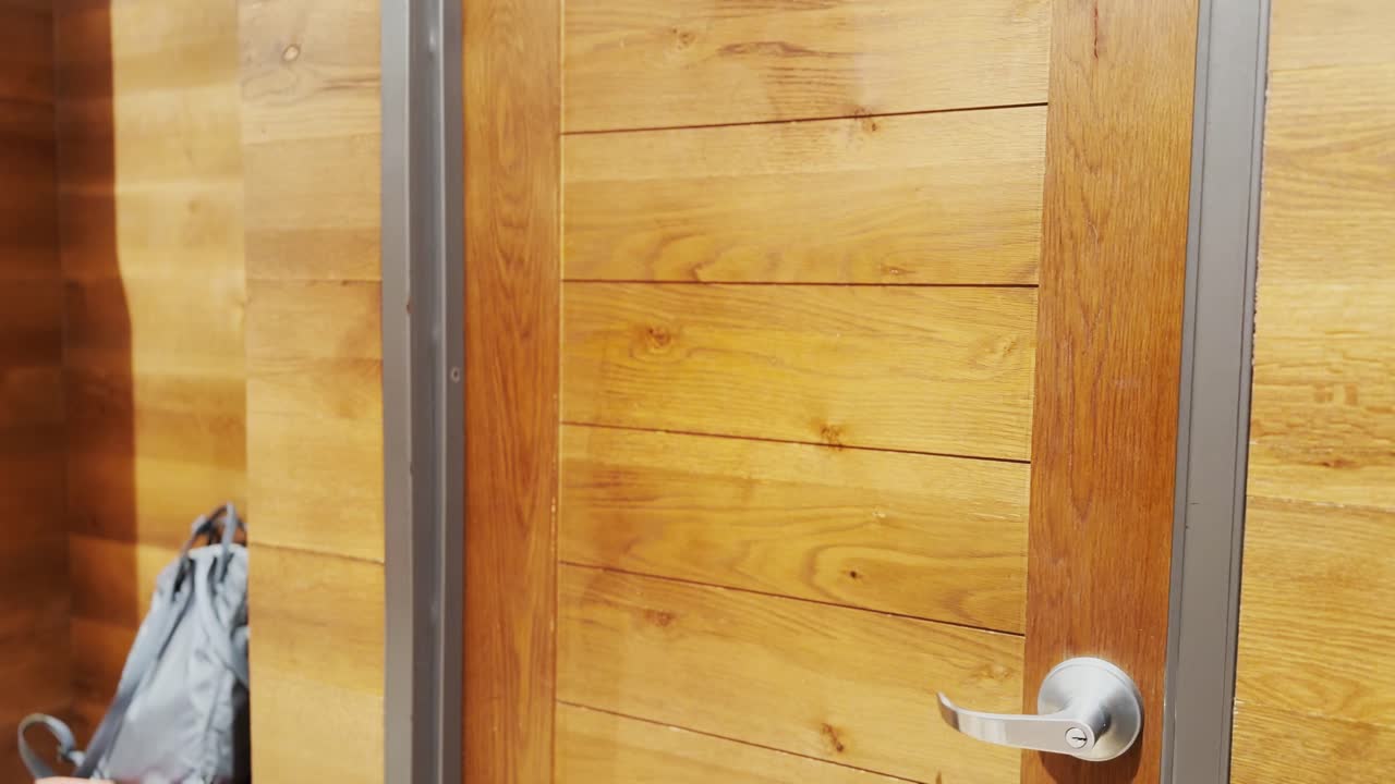 Woman trying on clothes in dressing room mirror